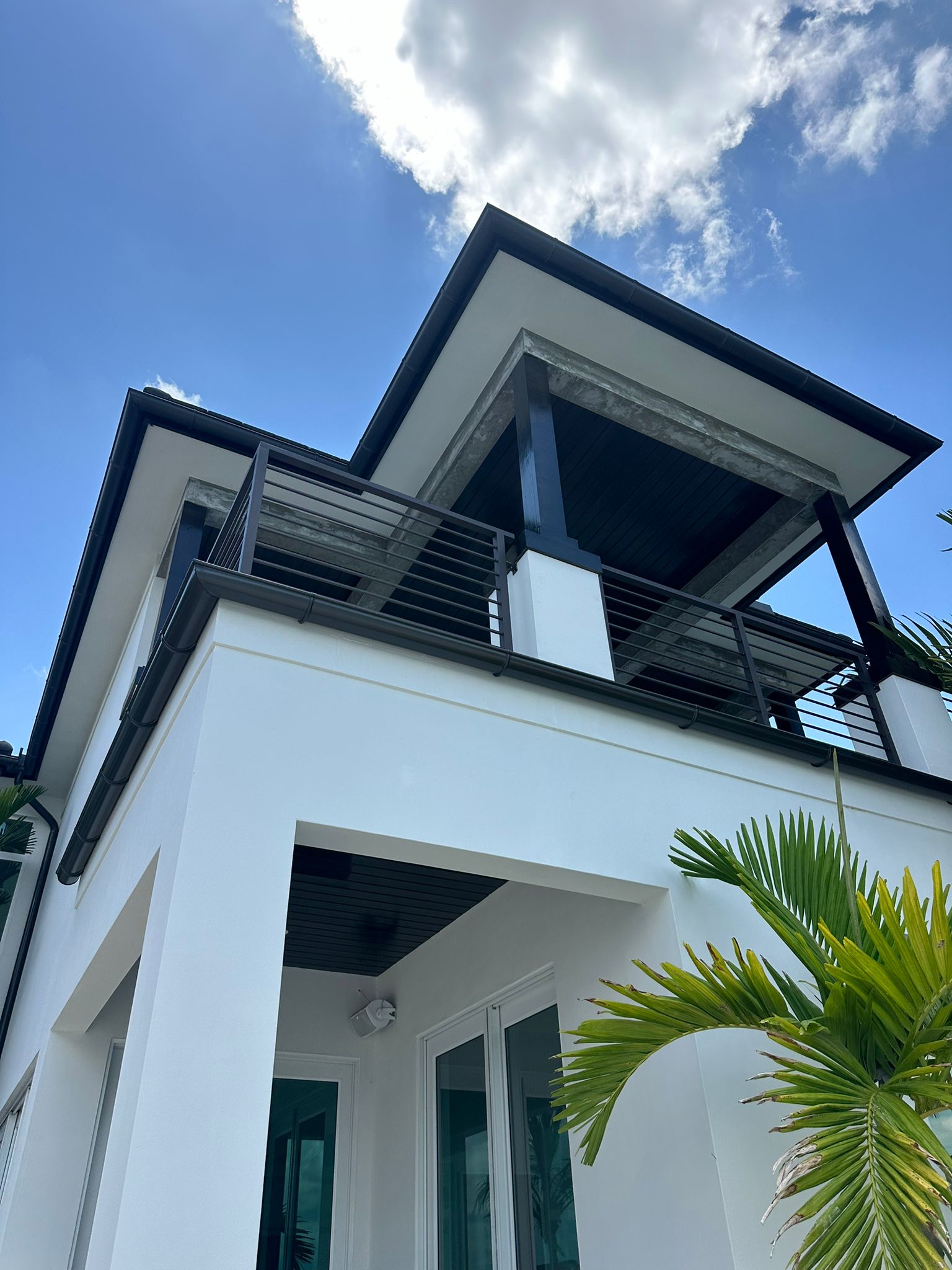Patio area with house and gutters